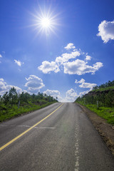 empty asphalt road on grassland