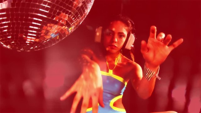 topless woman dancing covering with her hands