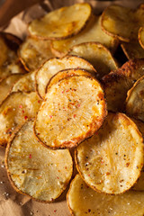 Fototapeta na wymiar Homemade Spicy LIme and Pepper Baked Potato Chips
