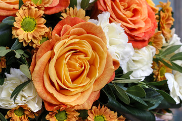 Bouquet of orange roses and white carnation flowers
