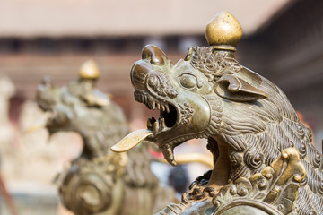 Brass lions outside a shrine in Bhaktapur, Nepal