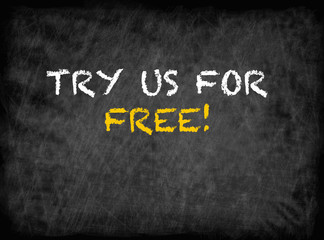 Obraz premium Try Us For Free - text on chalkboard