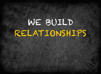 Fototapeta na wymiar We Build Relationships - text on chalkboard