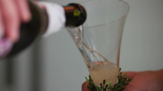 Man pouring champagne into glasses