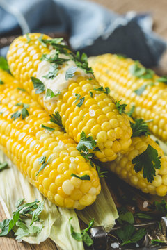 Homemade Boiled Corn On Cob With Butter And Salt On Rustic Table