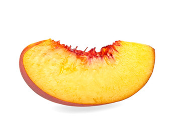 Nectarine fruit segment isolated on white background, close up