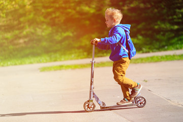 happy little boy riding scooter, active kids © nadezhda1906