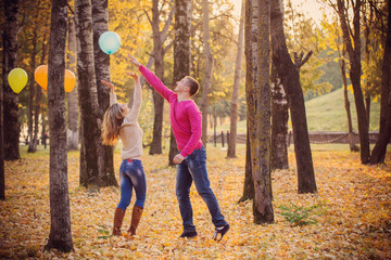 Fototapeta premium young couple in autumn park