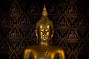 Fototapeta premium A beautiful golden Buddha statue in a temple in Nan province, Thailand