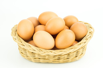 Eggs in basket isolated on white background