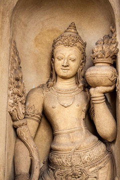 A carving of a doorkeeper at the Kelaniya temple, Sri Lanka. 