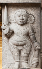 Carving of dwarf-like Yakshas at the Kelaniya temple in Sri Lanka.