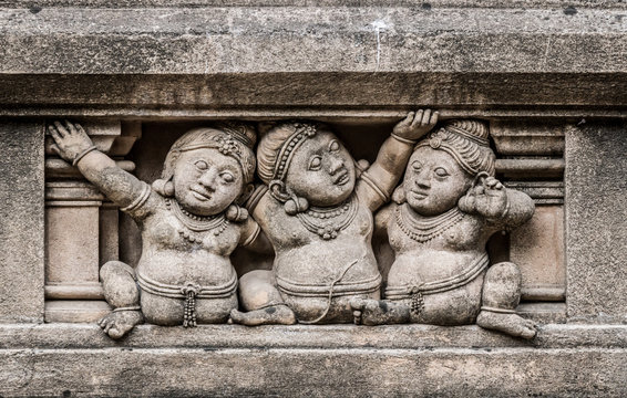 Carving of dwarf-like Yakshas at the Kelaniya temple in Sri Lanka.