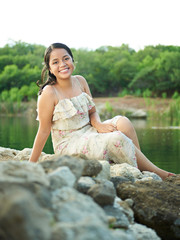 girl sitting on rocks