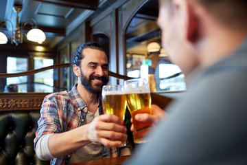 happy male friends drinking beer at bar or pub