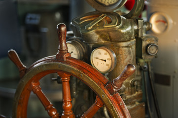 Fototapeta premium wood steering wheel in big ship
