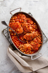 Chicken stew or ragout with nuts, carrot and tomato sauce