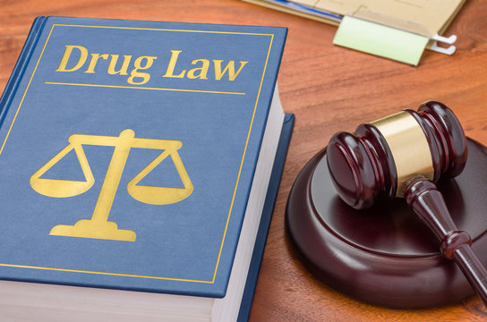 A law book with a gavel - Drug law