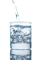 Drinking water is poured into a glass