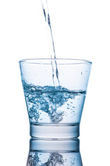Drinking water is poured into a glass
