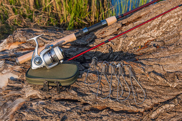 Fishing rod and reel on the natural background. Fish stringer an