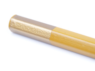 beige pencil on a white background