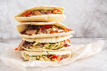Meat pita bread with yogurt sauce and mint leaves