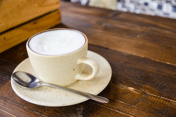 white coffee cup on table