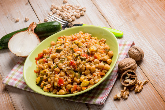 barley risotto with zucchinis chickpeas nuts and tomatoes
