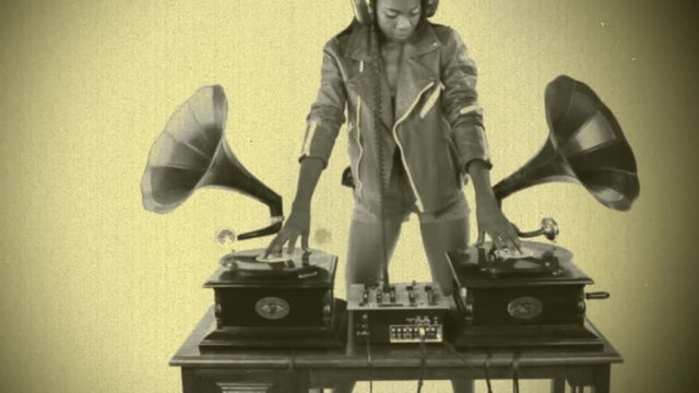 woman dj using two retro antique gramophones