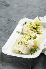 Carp fish with egg yolk sauce and herbs