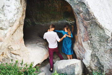 Fototapeta na wymiar Nice couple almost getting out the cave