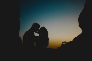 Fototapeta na wymiar Almost kissing couple in twilight