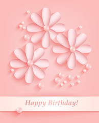 Pink background with paper flowers and pearls