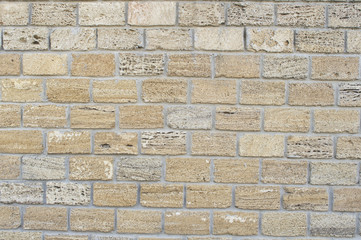 Wall of yellow coquina blocks