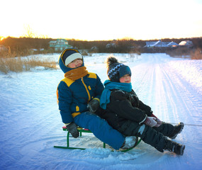 Fototapeta na wymiar happy boy with sled