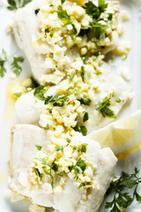 Carp fish with egg yolk sauce and herbs