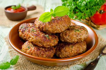 Juicy delicious cutlets with oatmeal. Rustic style