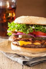 bacon cheese burger with pickles tomato onion