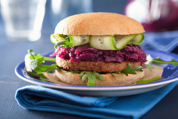 veggie soy burger with pickled red cabbage cucumber arugula