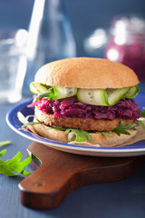veggie soy burger with pickled red cabbage cucumber arugula