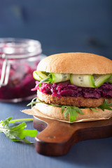 veggie soy burger with pickled red cabbage cucumber arugula