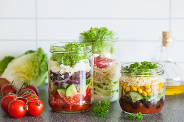 healthy vegetable cheese salad in mason jars