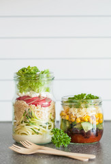 Fototapeta na wymiar healthy vegetable cheese salad in mason jars