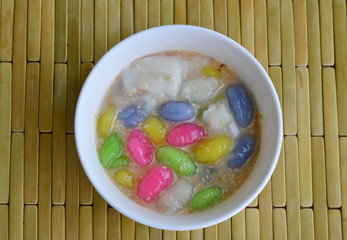 colorful caramel crisp in coconut cream on bowl
