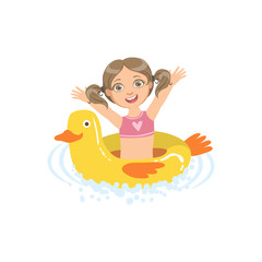 Girl In Water With Toy Duck Float