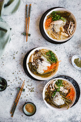 Asian miso broth soup over dinner table.