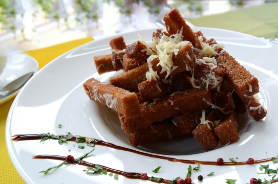Snack  for beer: rye bread croutons with garlic cream cheese sauce.