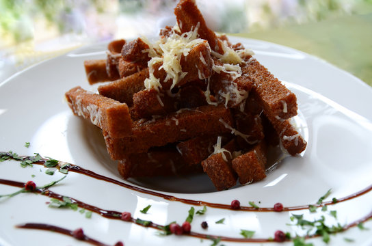 Snack  for beer: rye bread croutons with garlic cream cheese sauce.