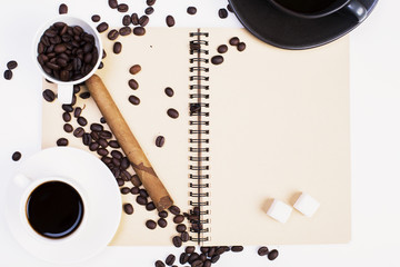 Spiral notepad, coffee and cigar